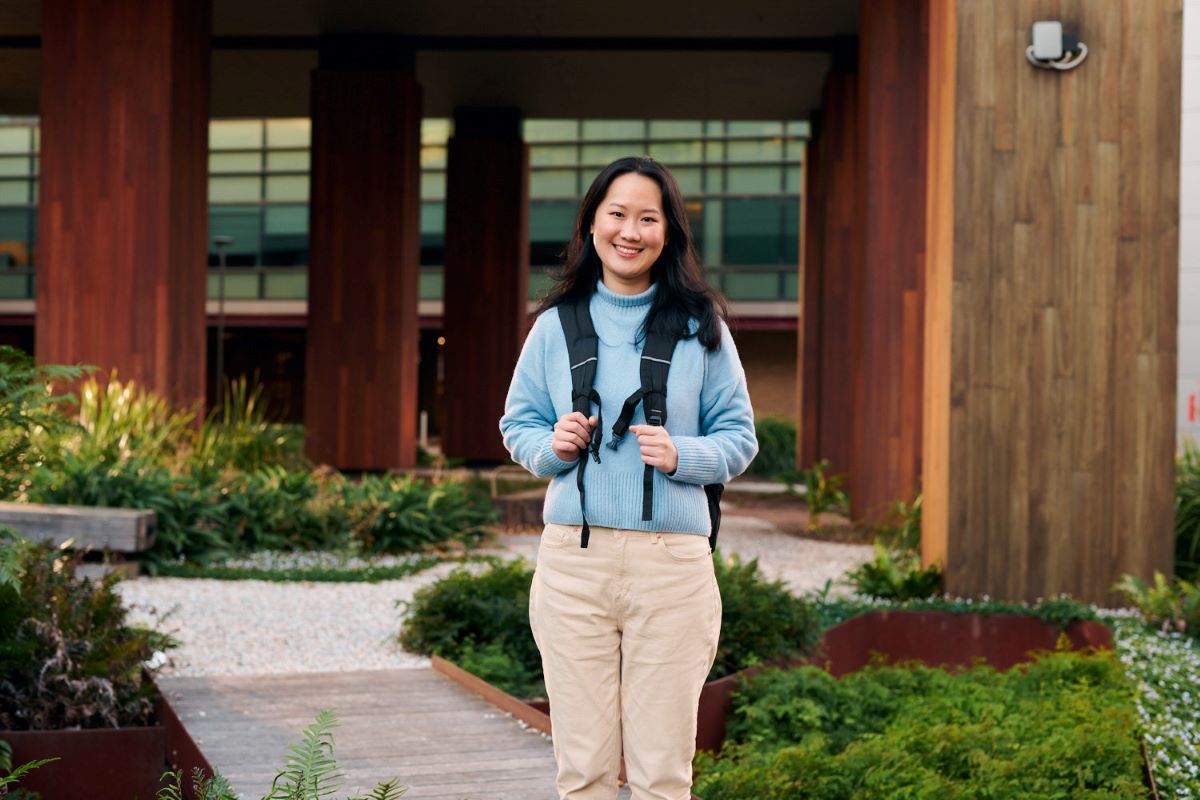 A student standing outside her campus