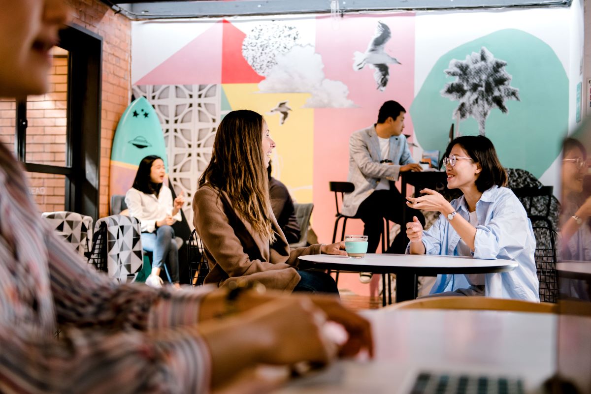 Two international students having a coffee at a trendy Gold Coast cafe