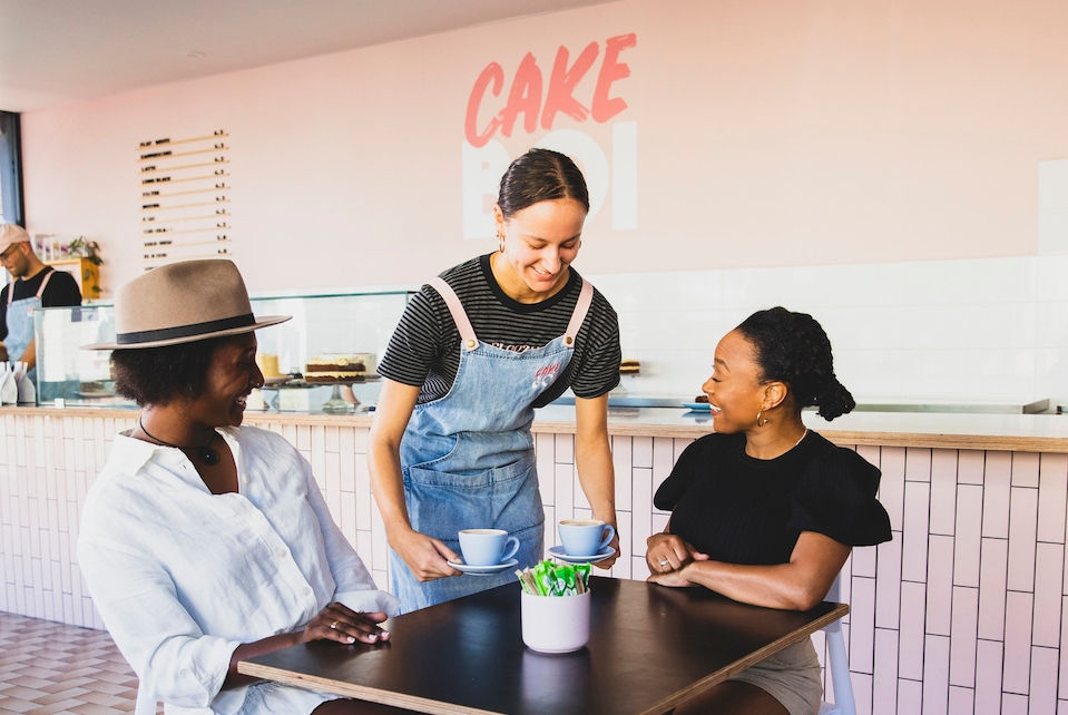 Friends enjoying coffee at the Cake Boi store in Hamilton, Newcastle.