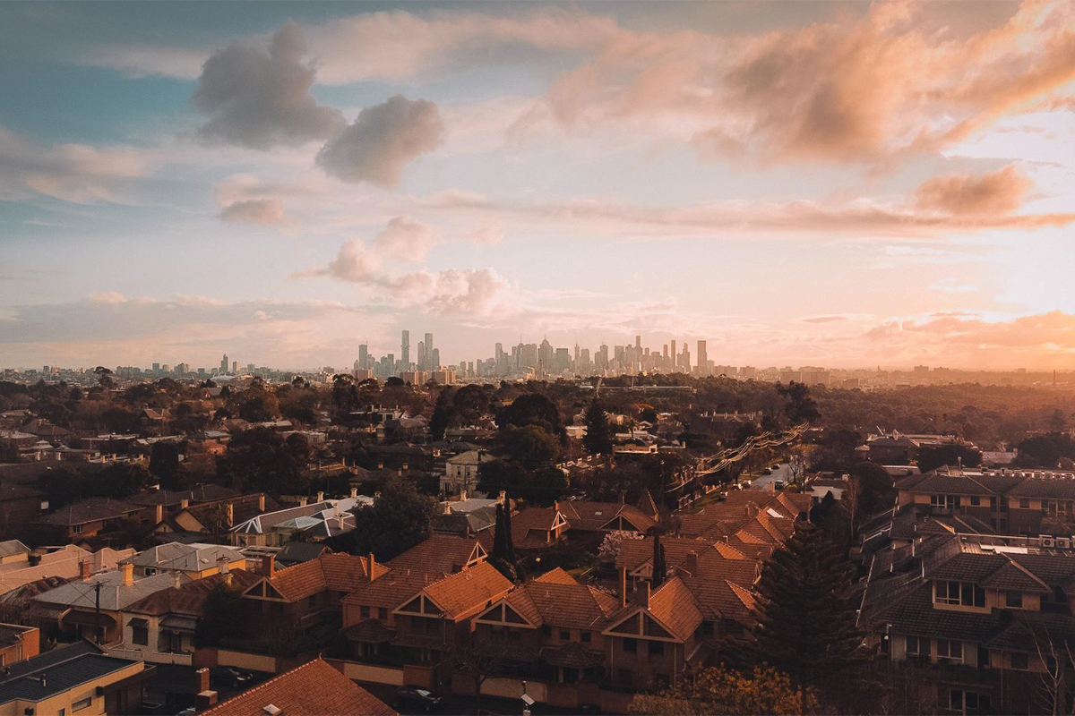 A sunset view of the Sydney CBD skyline from a high rise. 