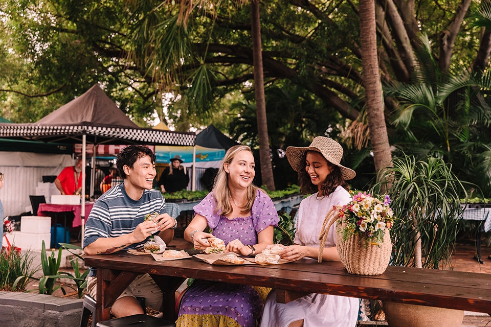 Group of friends having a casual bite to eat at the West End Markets