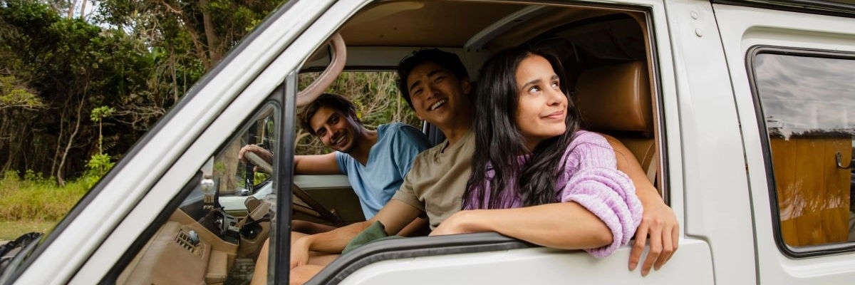 3 friends in a combi van