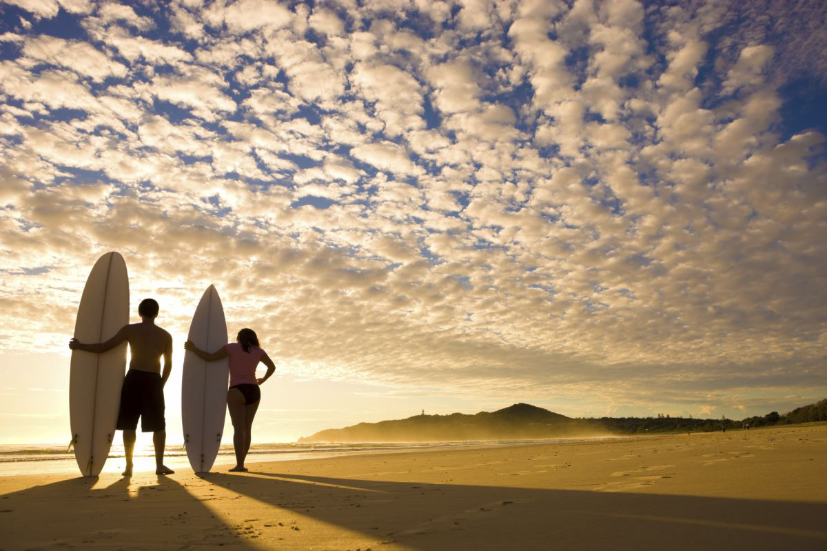 Surfers at sunrise, Byron Bay, New South Wales