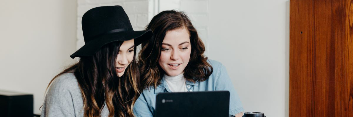    Two friends on a laptop