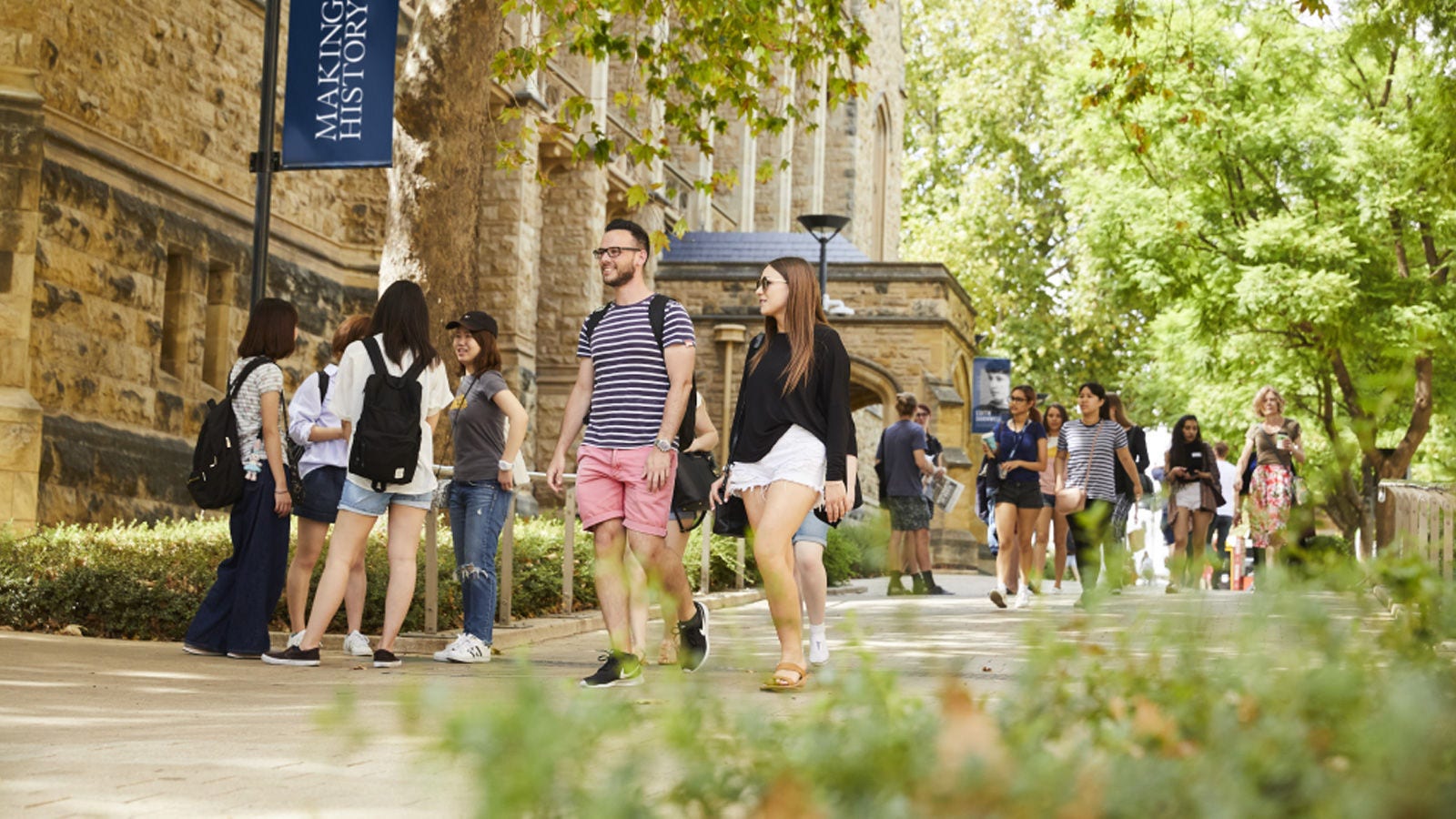 students walking through campus 