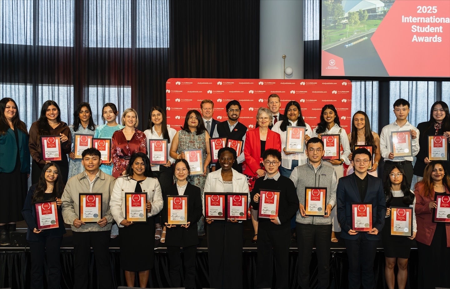2025 StudyAdelaide International Student Awards winners and finalists standing with their certificates