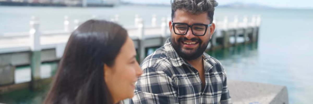Vish sitting on a pier chatting to a friend
