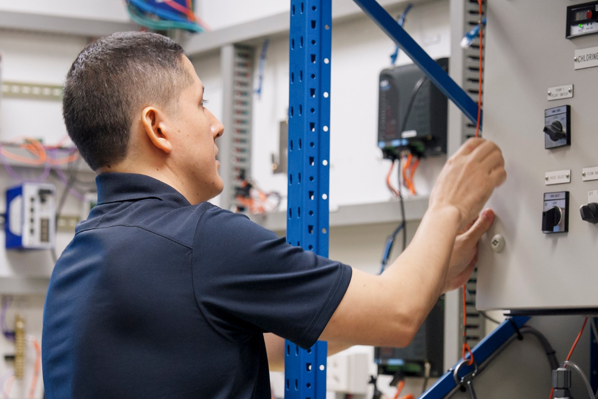 Raul from Peru working at a switchboard