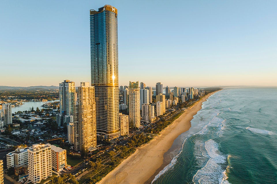 Aerial view of Meriton Suites Surfers Paradise including the skyline of Surfers Paradise and the beach. Image courtesy of Tourism and Events Queensland. 