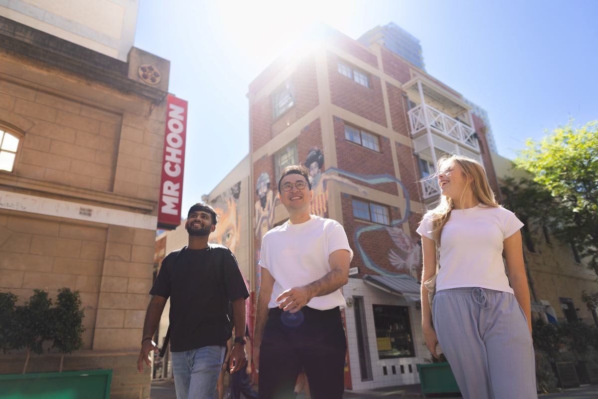 3 students walking in the Adelaide CBD