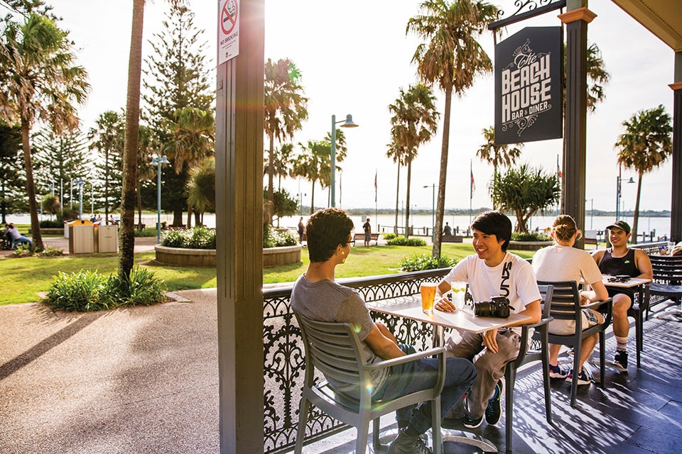 Friends enjoying afternoon drinks at The Beach House Restaurant and Bar, Port Macquarie.