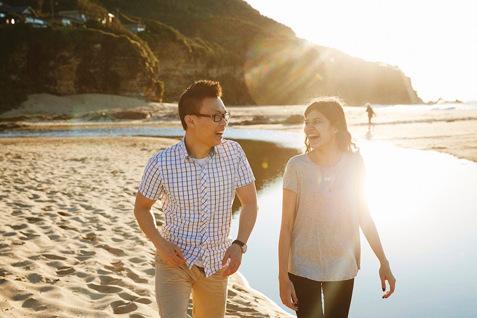 Two students walk along the beach at Stanwell Park, Wollongong, New South Wales. 