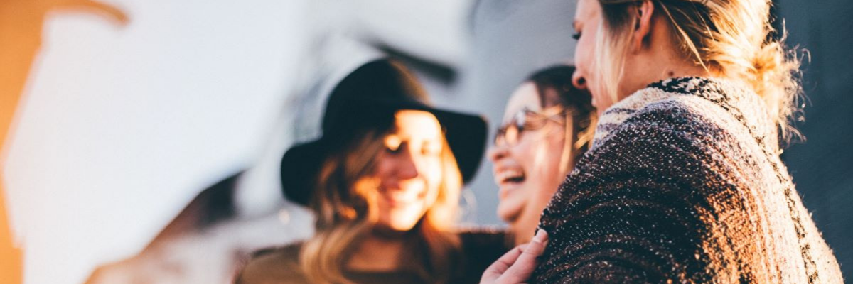 Three friends laughing