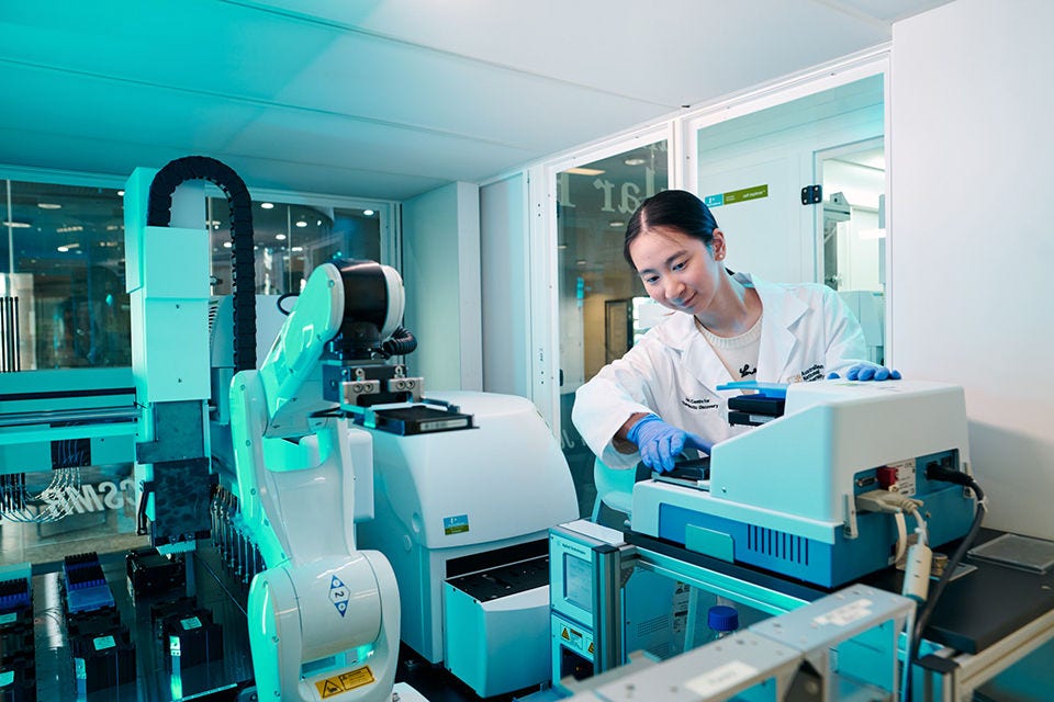 A female international PhD student is conducting research at the Biomedical Lab at the Australian National University.