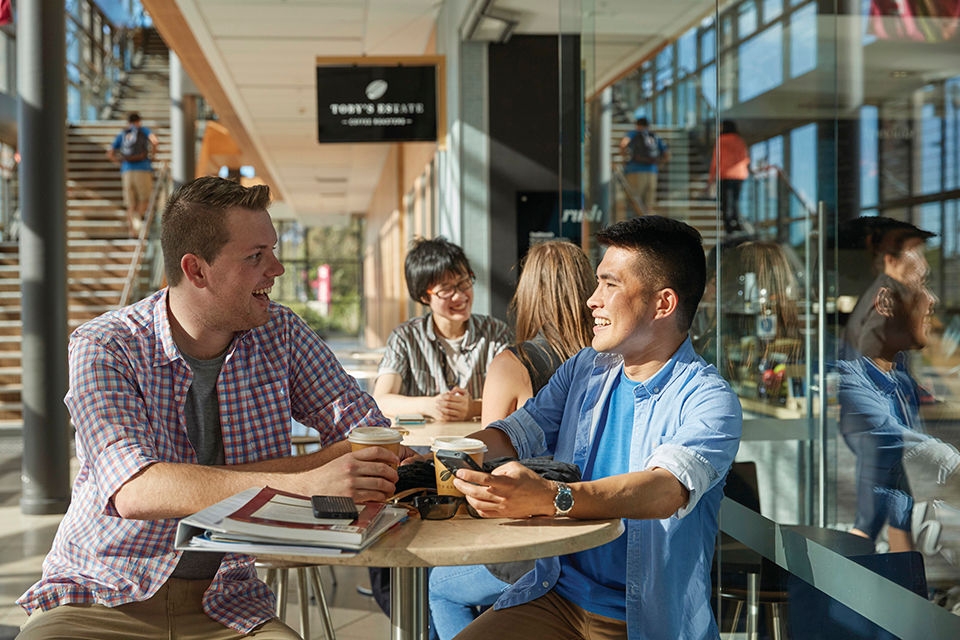 Students enjoying a coffee on site in the Innovation Campus, University of Wollongong.