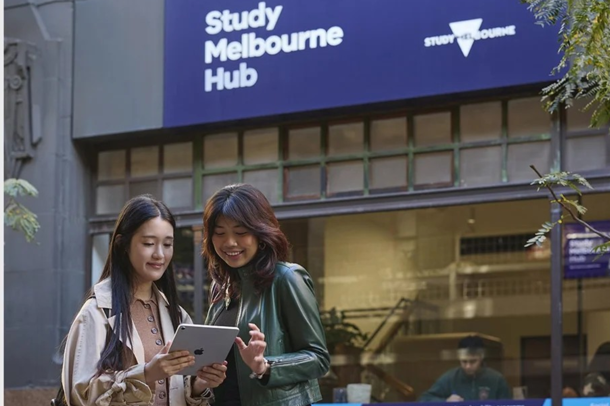 Two students outside the Study Melbourne Hub