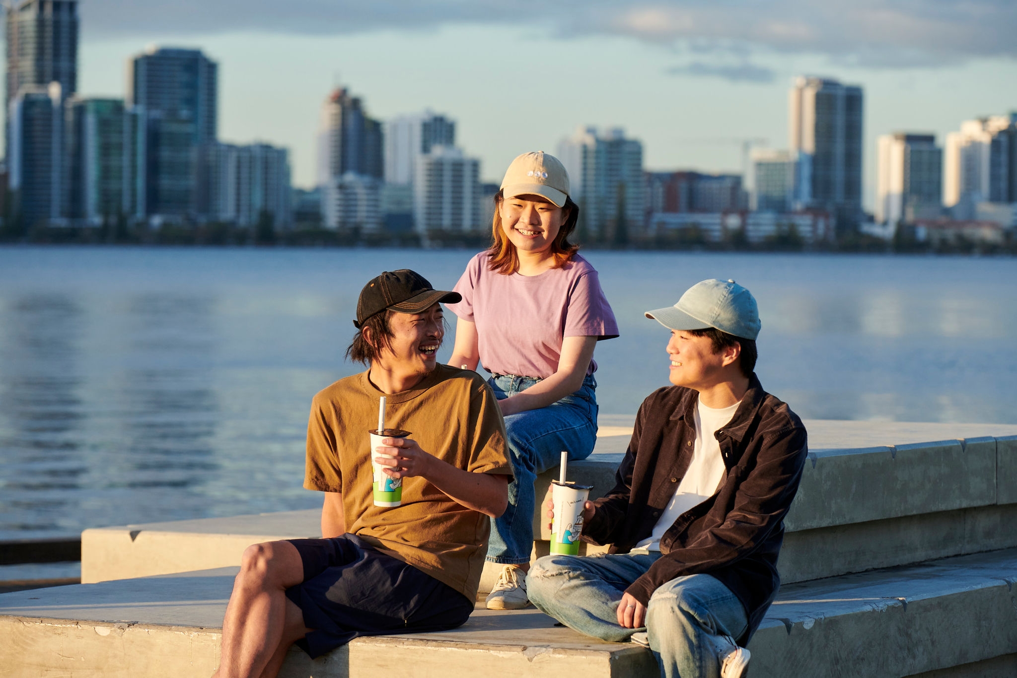 Three students by the river in Perth