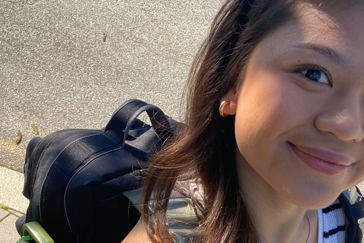 A selfie of Grace walking down the street 